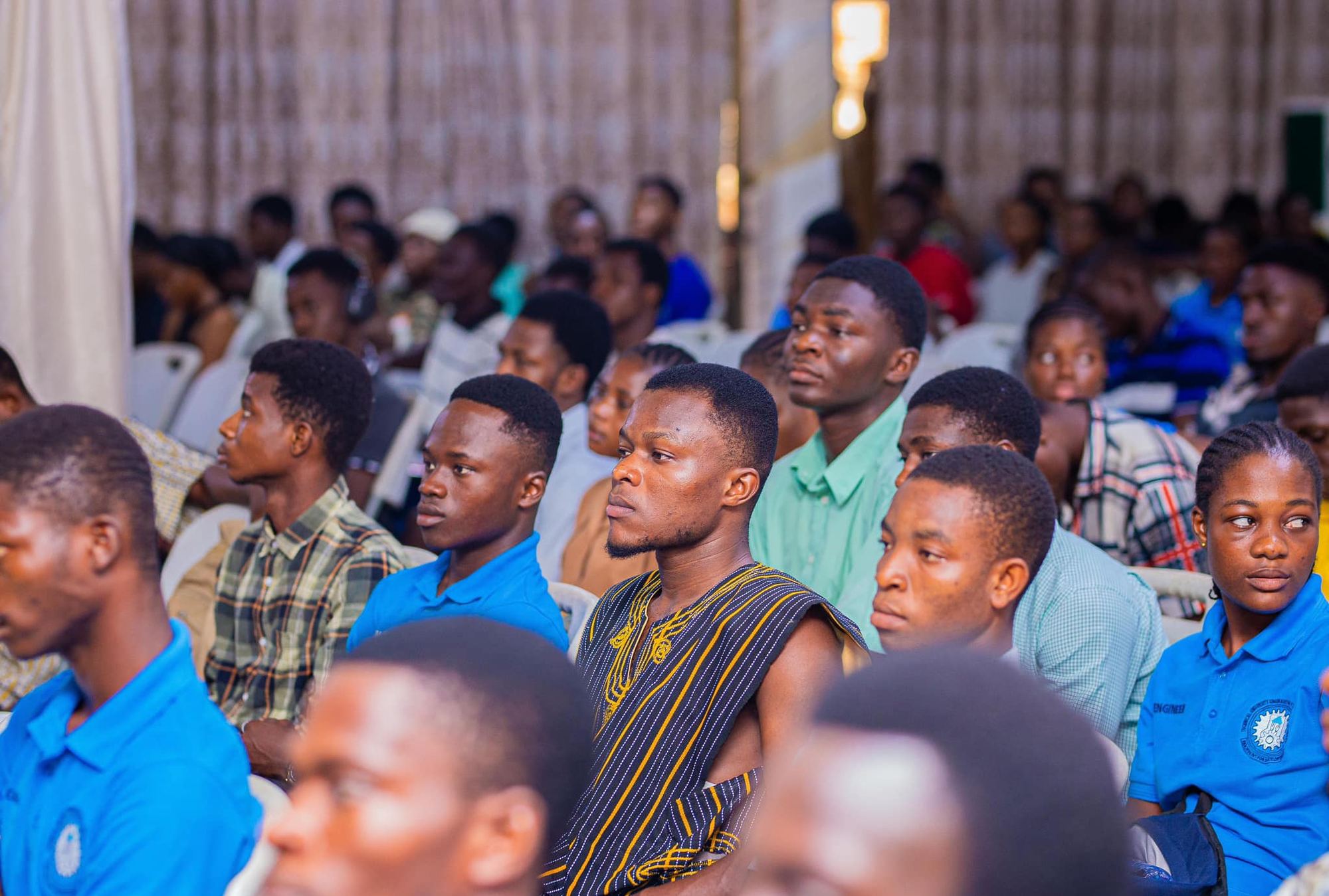 Students listening closely during a REACO training session